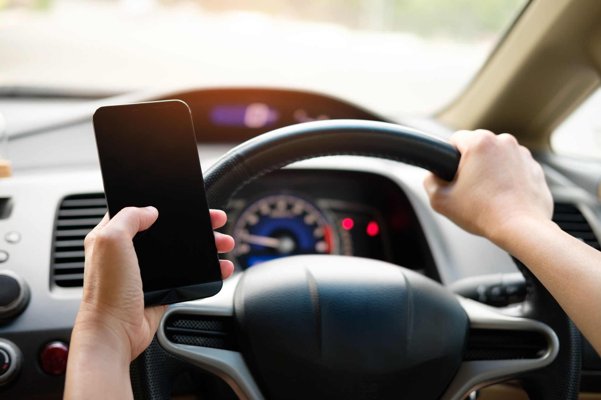 Driver using a mobile phone while driving